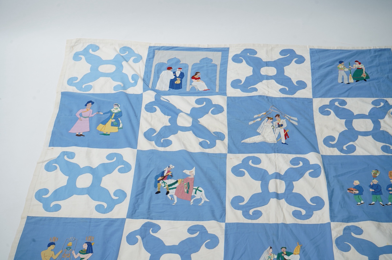 A rare figurative American ‘bridal quilt coverlet’, designed by Marion Cheever Whiteside Newton, whose designs were originally widely published in magazines and sold during the 1940’s-50’s. Her ‘quilting kits’ were also